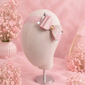 Pink glitter bow headband with gold gem on pink lace